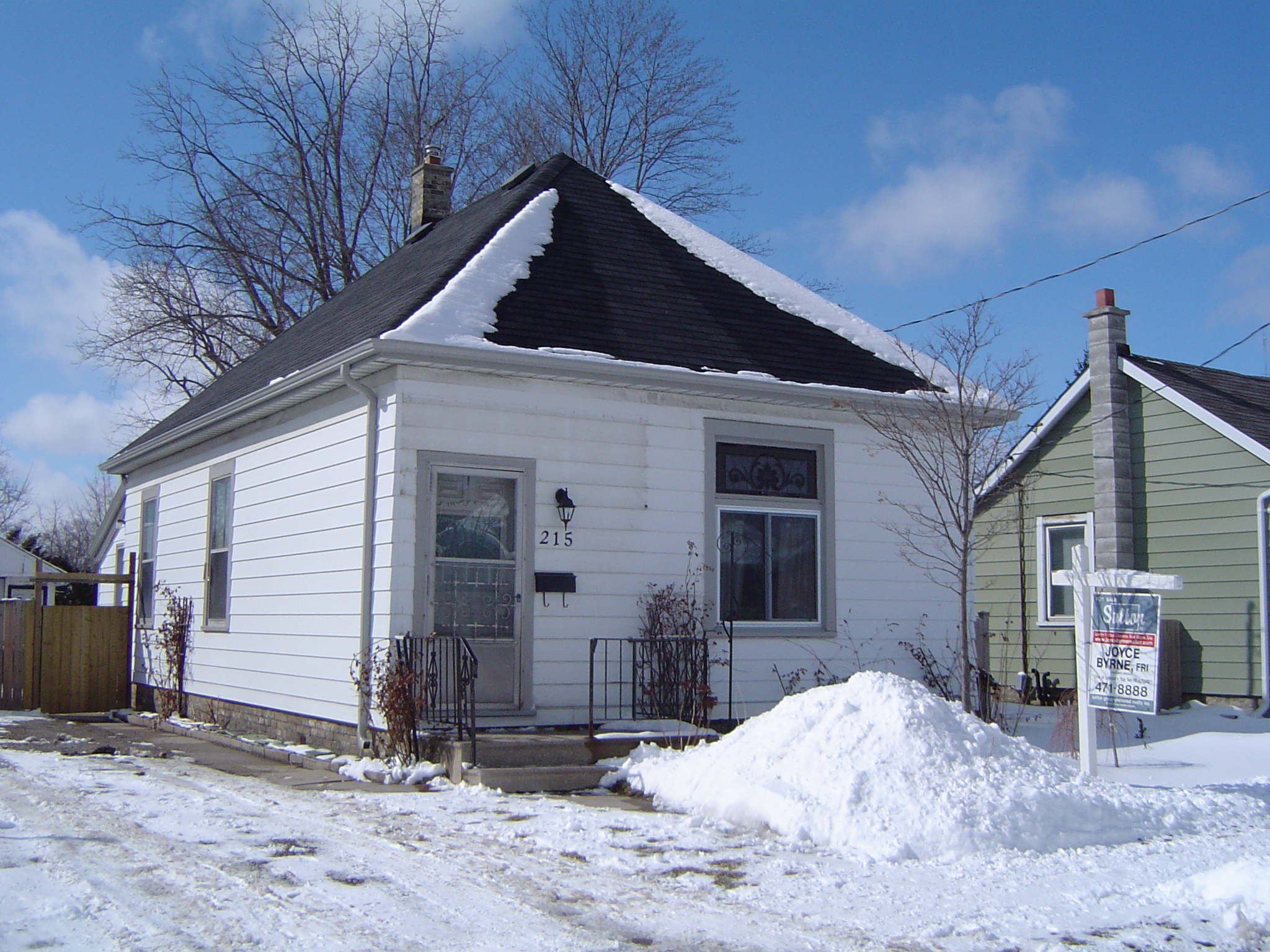 2 bedroom bungalow situated on a fenced lot with garage