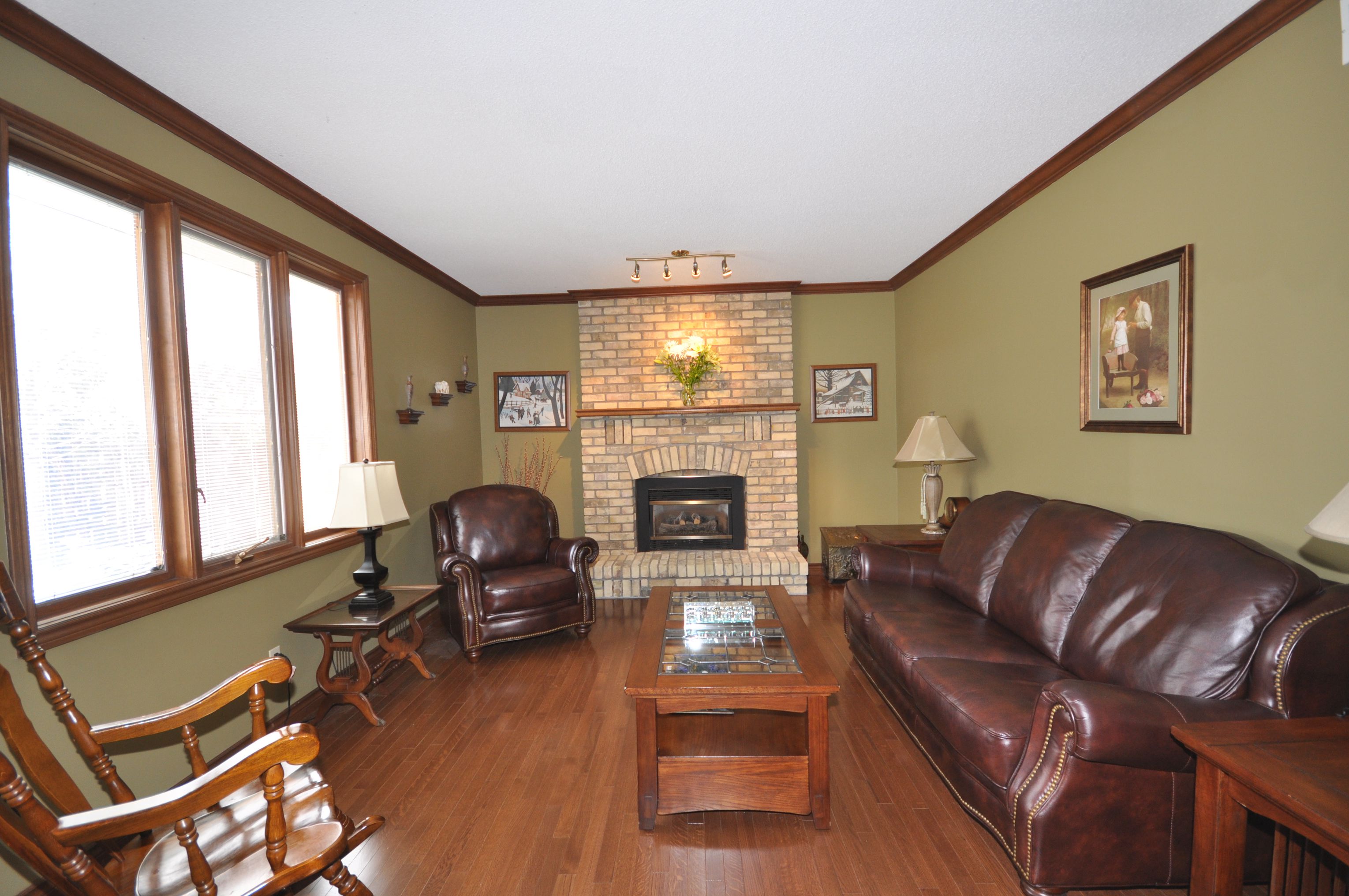 Sunken Family Room with floor to ceiling brick gas fireplace