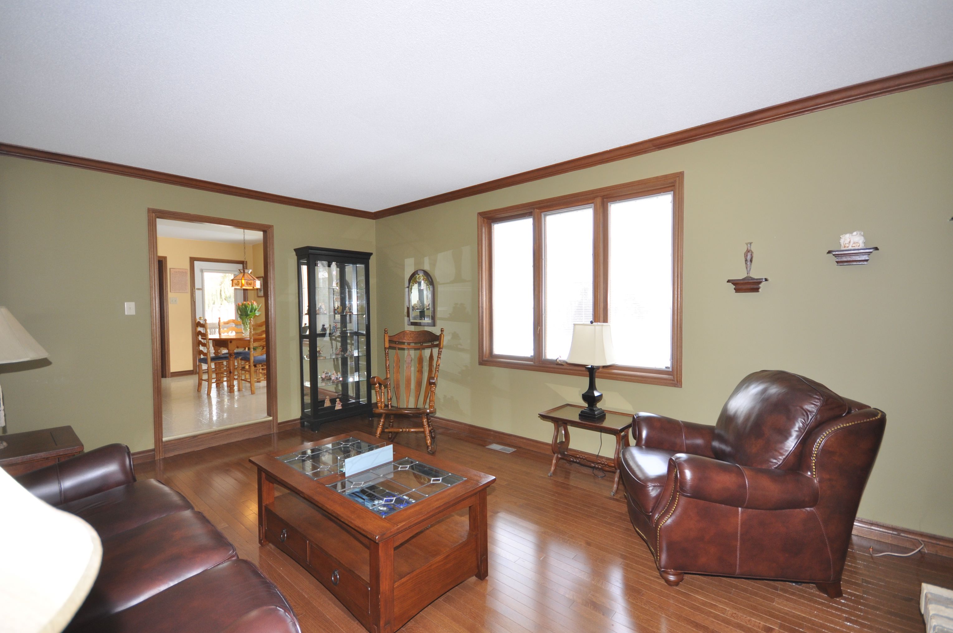 Gleaming oak hardwood flooring, trim & crown moulding in the Family Room