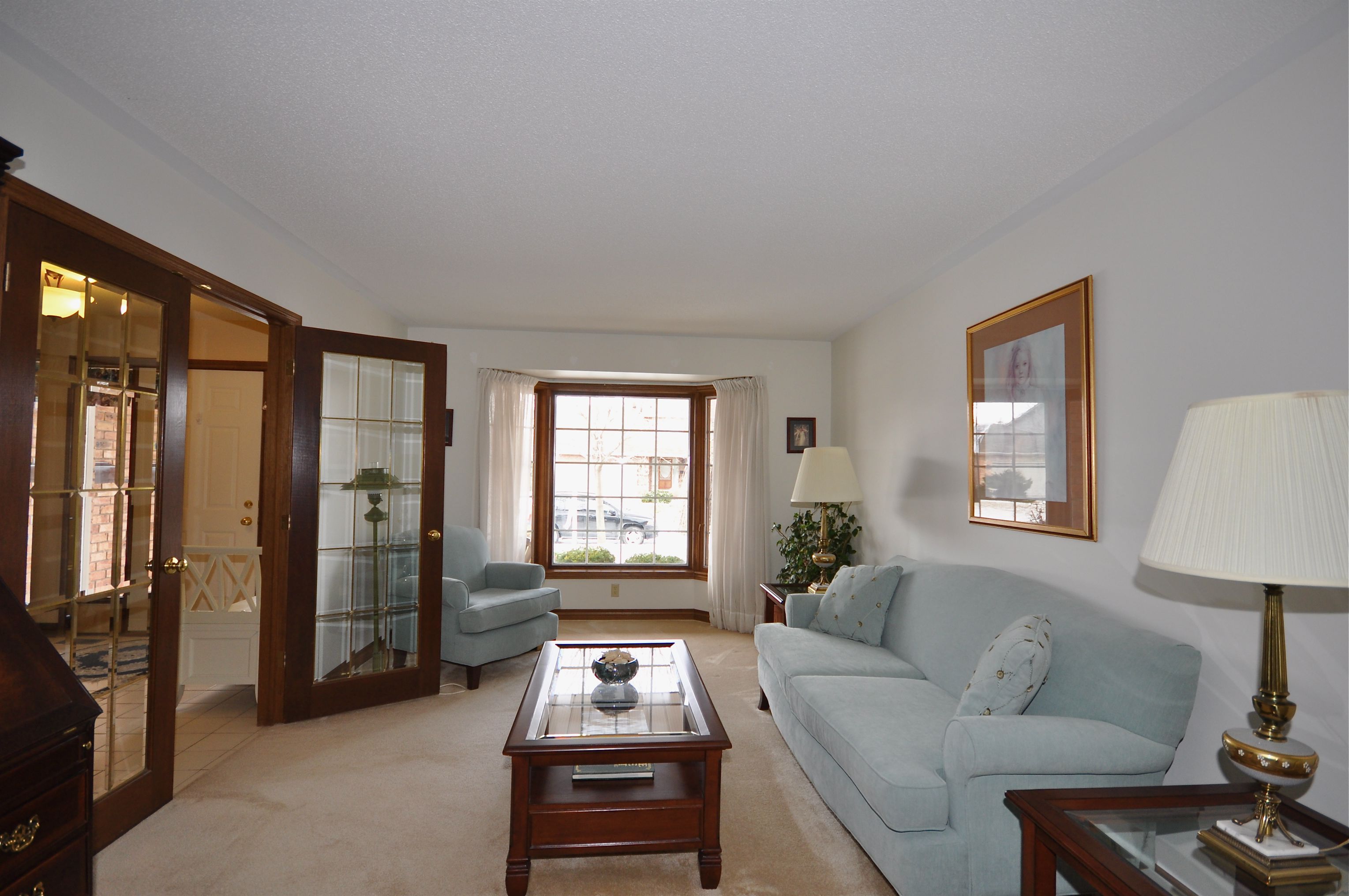 French doors to Living Room with large sunny bay window