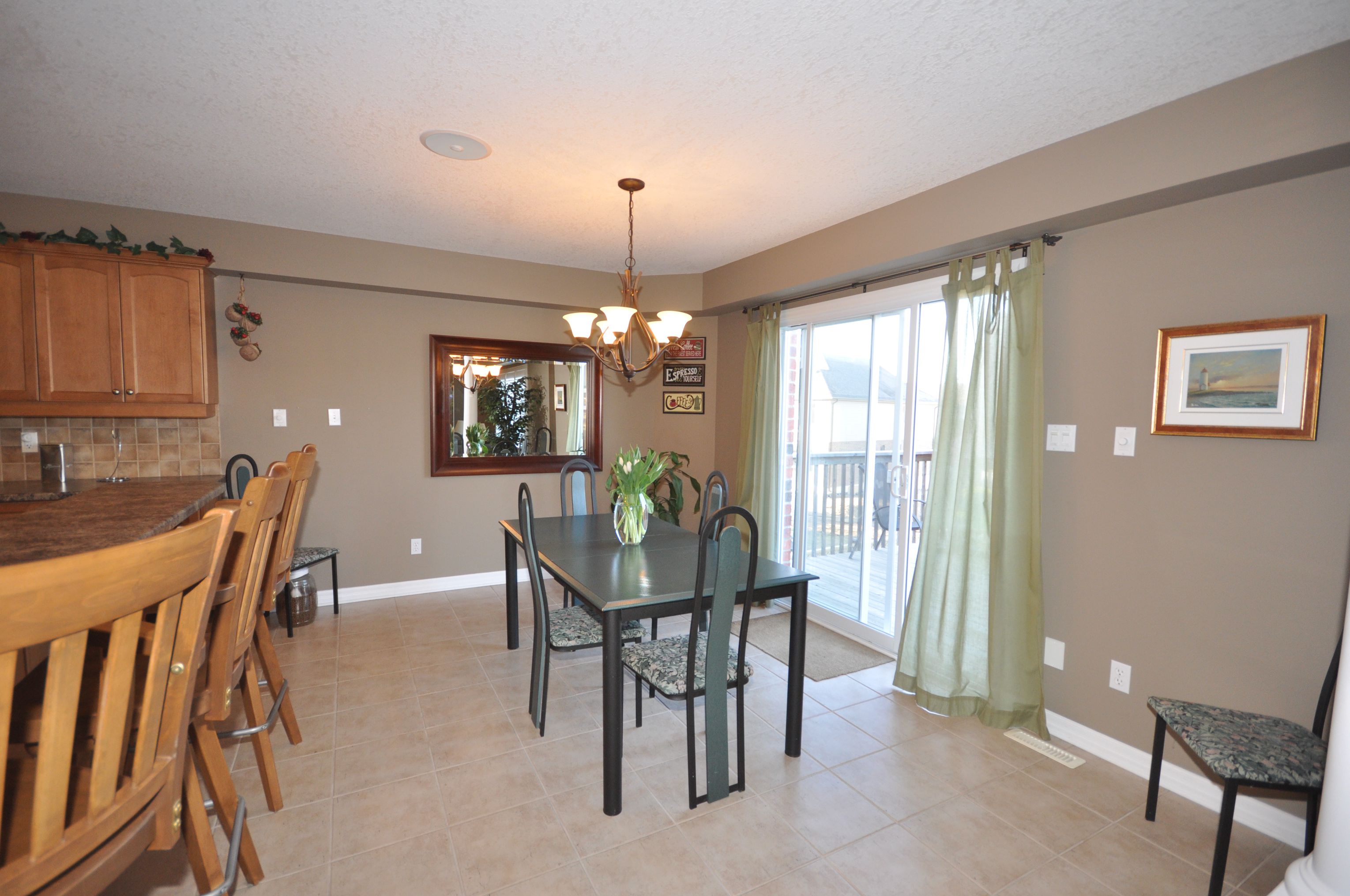 Eating area with glass doors to raised sundeck