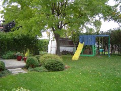 Professionally landscaped yard complete with play gym for the little ones 