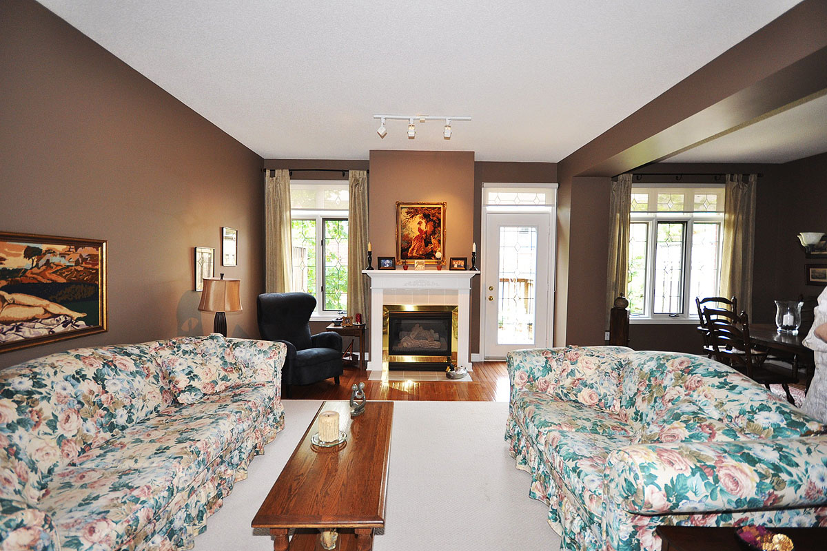 Living Room has cozy gas fireplace and door to sundeck