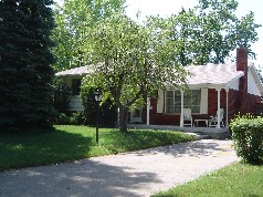 4 level split with covered front porch located in Huron Heights 