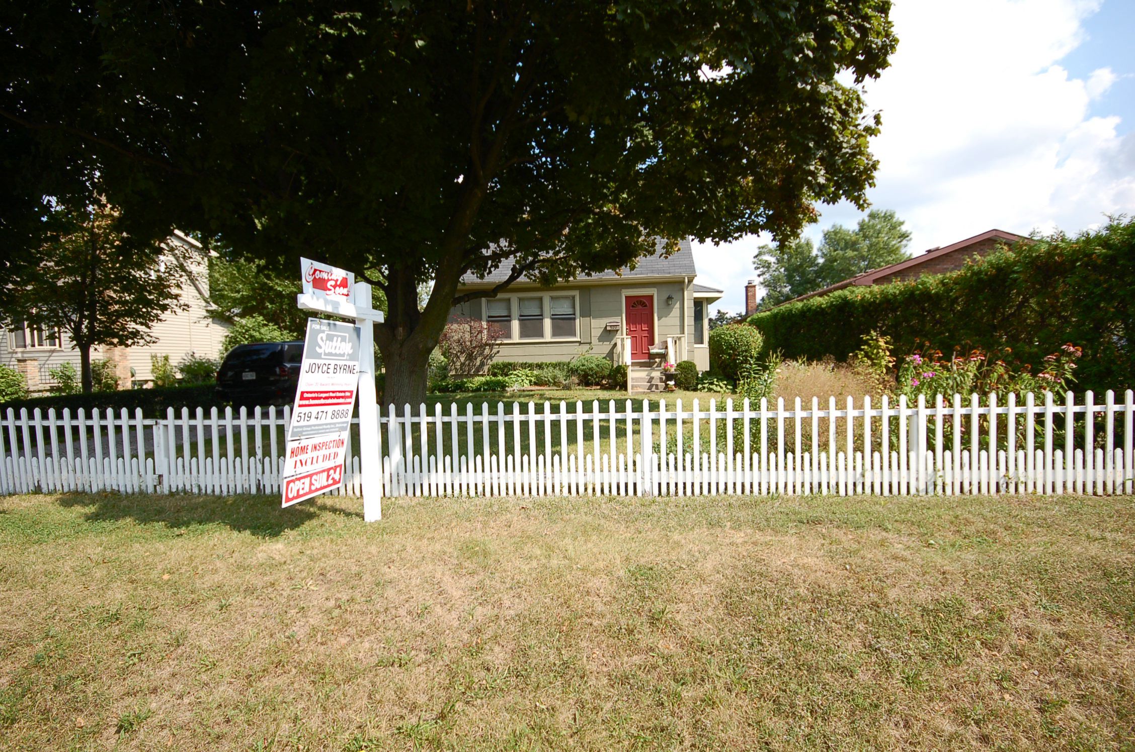 Attractive "Doll House" curb appeal with 3 finished levels