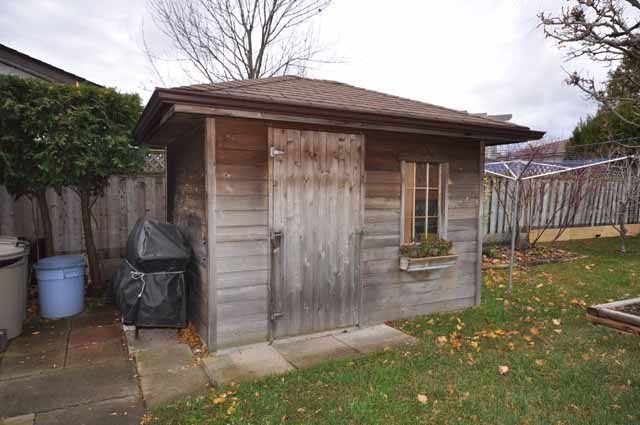 Cedar shed on concrete pad