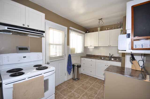 Kitchen with door to Concrete Patio