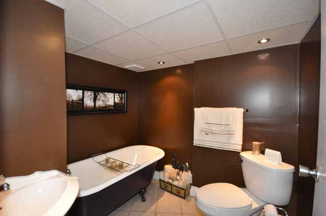 Newer bath with antique claw foot tub in lower level