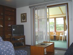 Sliding doors from the main floor family room to the 3 season sunroom 