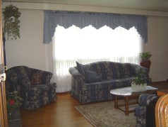 Bright sunny window in the large living room 