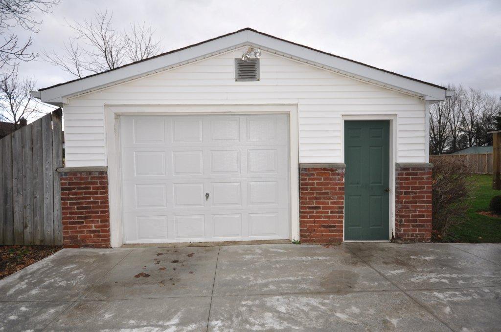 Oversized detached garage with thermostatically controlled heat & its own hydro panel with 110 and 220!