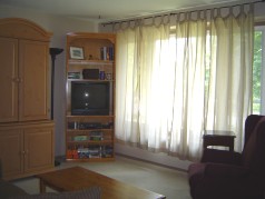 Living room with large sunny windows