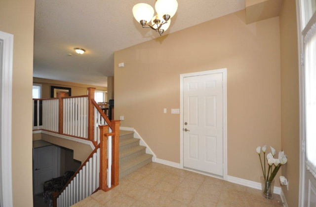 Ceramic Tiled Foyer & View to Main Room