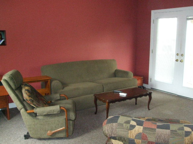 Spacious family room with terrace doors to covered sundeck