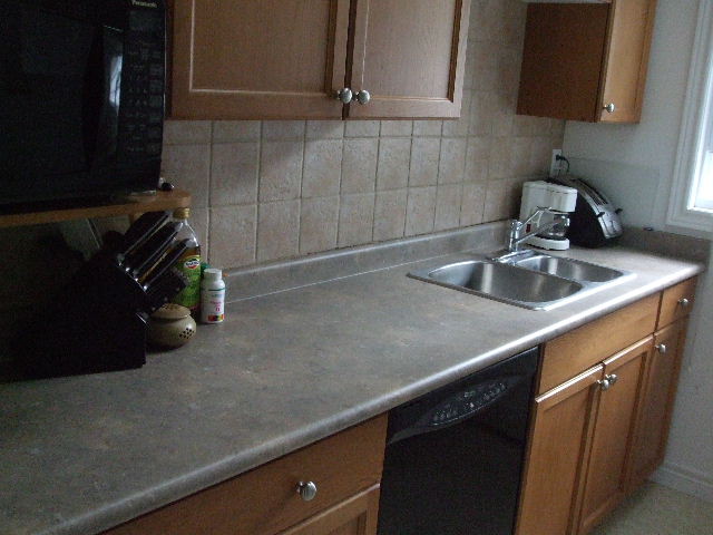 Galley kitchen with oak cupboards