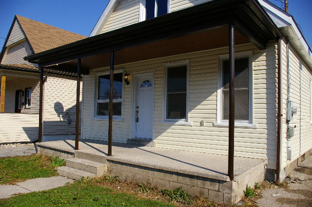 Covered Front Porch and Attached Gargage with new door and seperate electrical panel