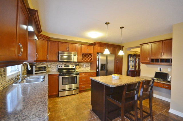 The Kitchen boasts a Luncheon Counter, Pantry and Desk