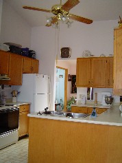 Spacious working area in cupboard laden kitchen 