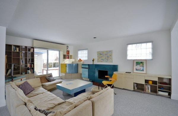 Living Room with Fireplace, Patio Doors to Deck and Walls of Built Ins