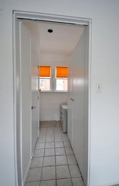 View into Hall to new Powder Room, Closet and Basement