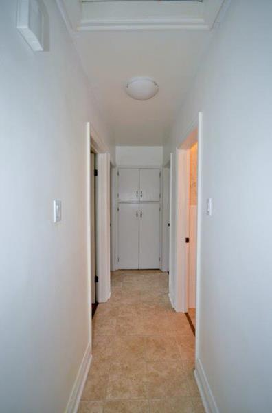 Newer flooring down hall to bedrooms