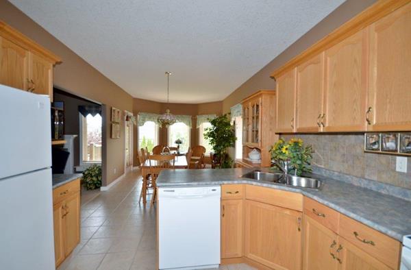 View from working area of Kitchen into eating area 