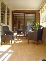 4 season sunroom off the family room leading to the backyard now also houses the laundry area 