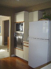 The kitchen offers a built in gas stove top, oven and a dishwasher too plus a built in desk 