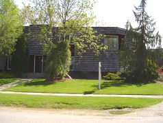 Side entrance to house. Note: Cedar Shake Roof. 