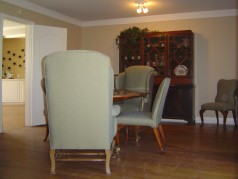 Formal dining room with hardwood floors and crown moldings 