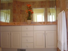 Marble ensuite with double sinks, and a large glass shower