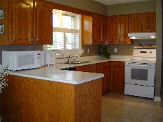 Large eat in cupboard laden kitchen is designed for the gourmet in the family 