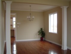 Custom designed pillars separate the living room from the formal dining room