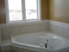 Corner soaker tub and separate shower in ensuite. 