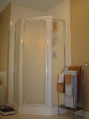 Corner shower plus ceramic flooring in the ensuite. 