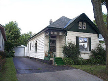 Front of house with parking pad