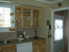 Large, bright and sunny eat in kitchen with new maple cabinetry