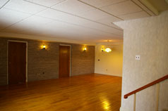 Family room with wood floor in 3rd level