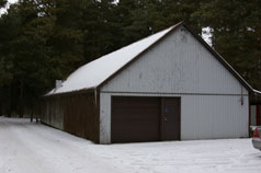 Front view of workshop with newer insulated garage door