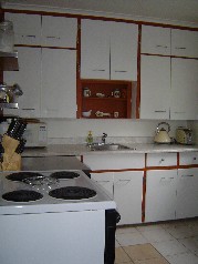 Kitchen has new ceramic flooring and door to the driveway making bringing in the groceries a breeze