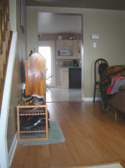 Open concept main floor with new laminate in living and dining room
