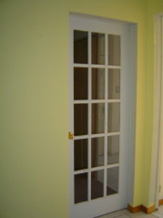 Glass door leading to main floor bedroom