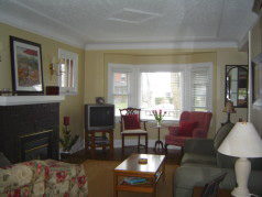  Firelit living room with large sunny window
