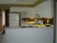  White kitchen with good cupboard & counter space for the chef in the family