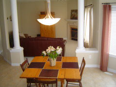 Family room opens to the eating area and is divided by attractive pillared walls