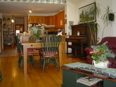 Eating area opens to the vaulted family room