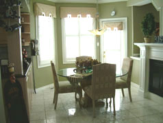 Sun drenched eat-in area with gas fireplace