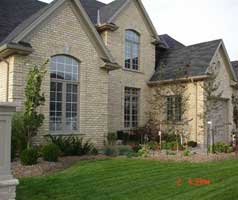  Extensive landscaping both front and back accentuates large windows