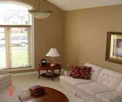 Sunny living room has built in elegant bookcase