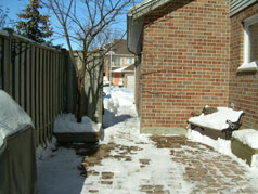  Another view of cobblestone patio at side of house